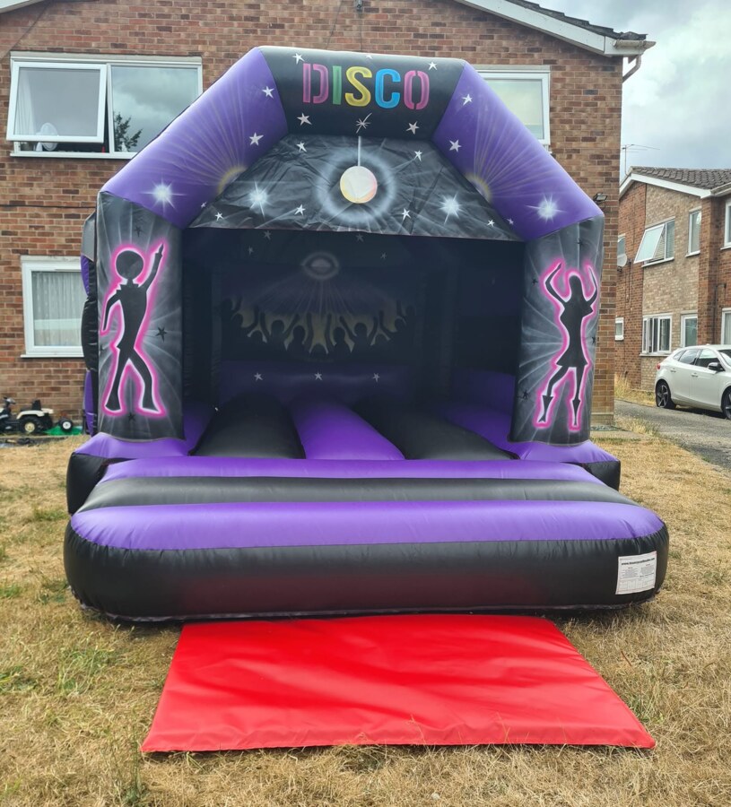 Purple and black Disco bouncy castle