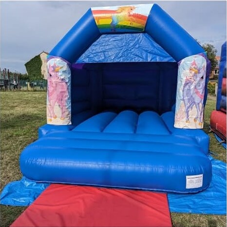 Covered unicorn and rainbow bouncy castle