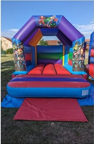 Superhero themed open-front bouncy castle